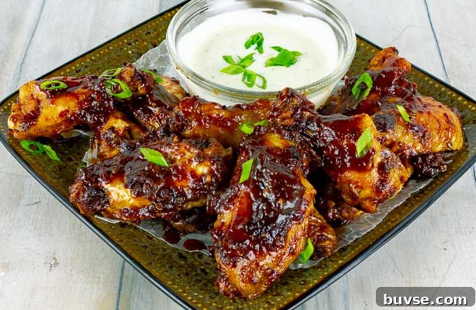 Baked Chipotle Barbecue Wings on square plate with ranch