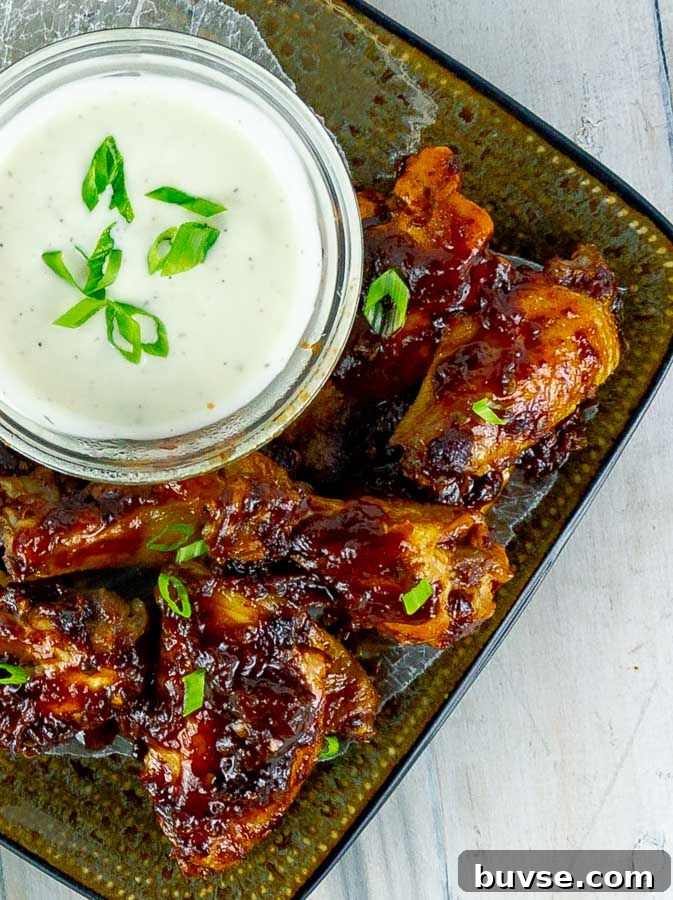 Baked Chipotle Barbecue Wings on square plate with ranch
