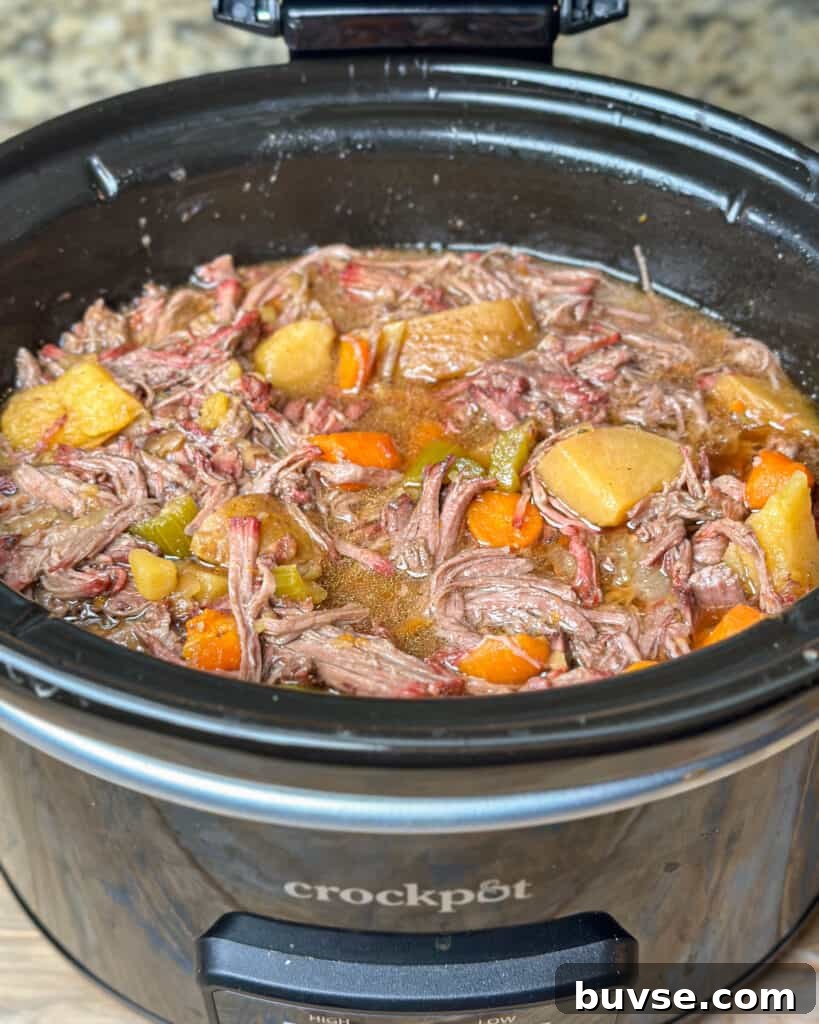 Smoked chuck roast being sliced