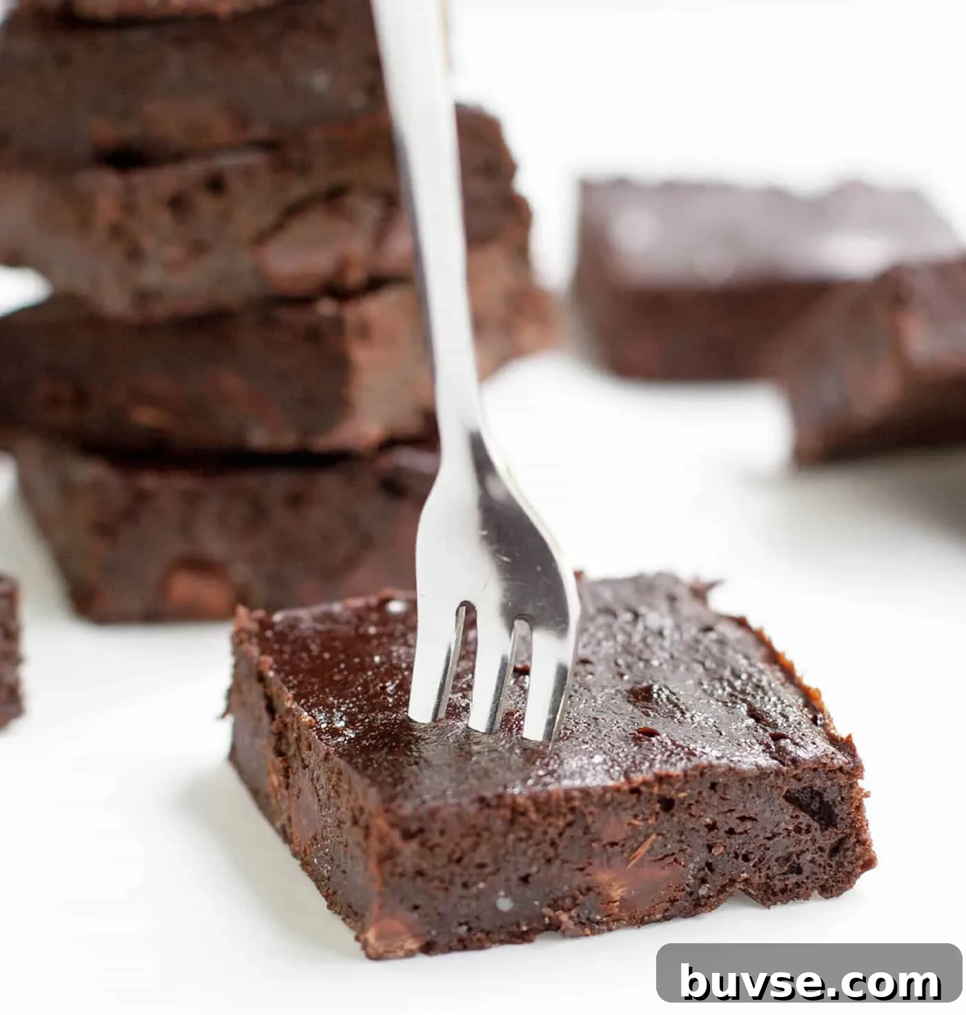 Fudgy Chocolate Zucchini Brownies Recipe 3 Fudgy Zucchini Brownies. A super fudgy brownie that mixes up easily in your food processor! Lower in sugar, flour and fat than many traditional brownie recipes.