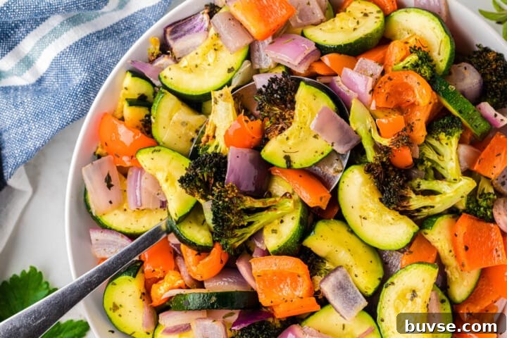 Crispy Air Fryer Vegetables: Quick Roasting Tips 3 closeup of air fryer vegetables in white serving bowl.