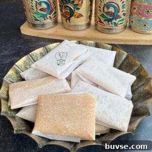 Delicious carrot and almond halwa served in traditional wraps, perfect for a sweet treat or dessert.