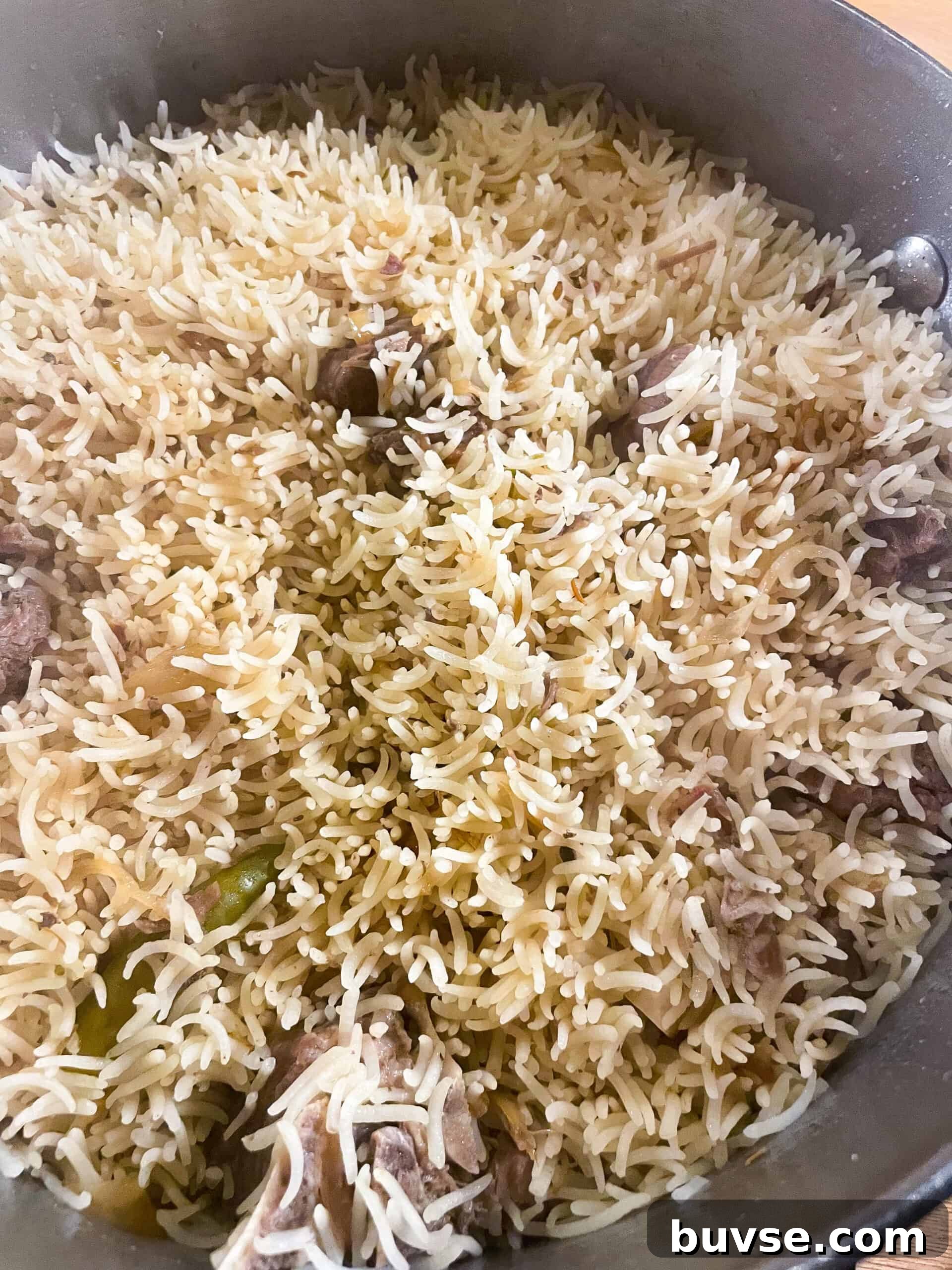 Mutton Yakhni Pulao Recipe: Aromatic Eid Rice Dish 10 Fluffy basmati rice