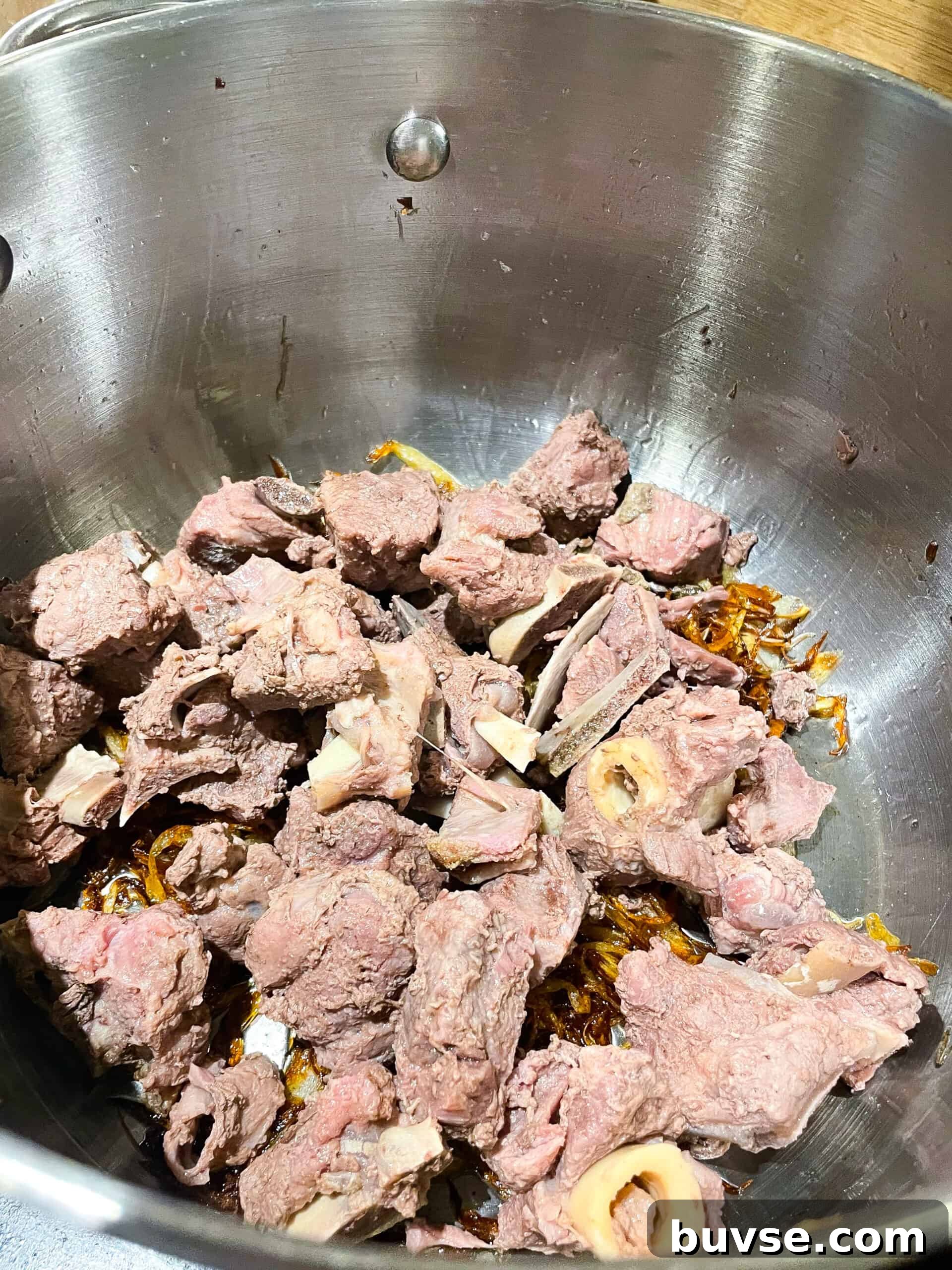Mutton Yakhni Pulao Recipe: Aromatic Eid Rice Dish 6 Browning onions and meat