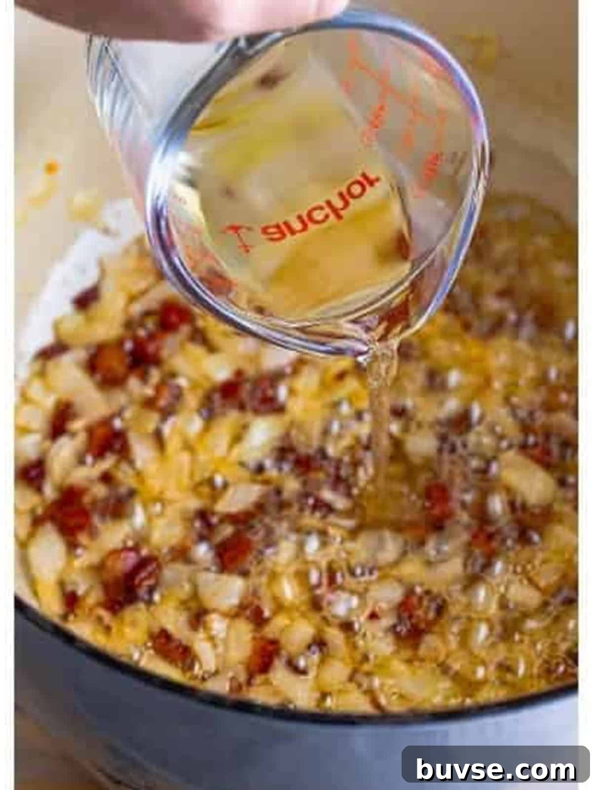 Amatriciana Pasta (Bucatini) - Authentic Italian Recipe 5 Onion, garlic, and red pepper flakes added to the crispy guanciale and deglazed with white wine for Pasta Amatriciana.
