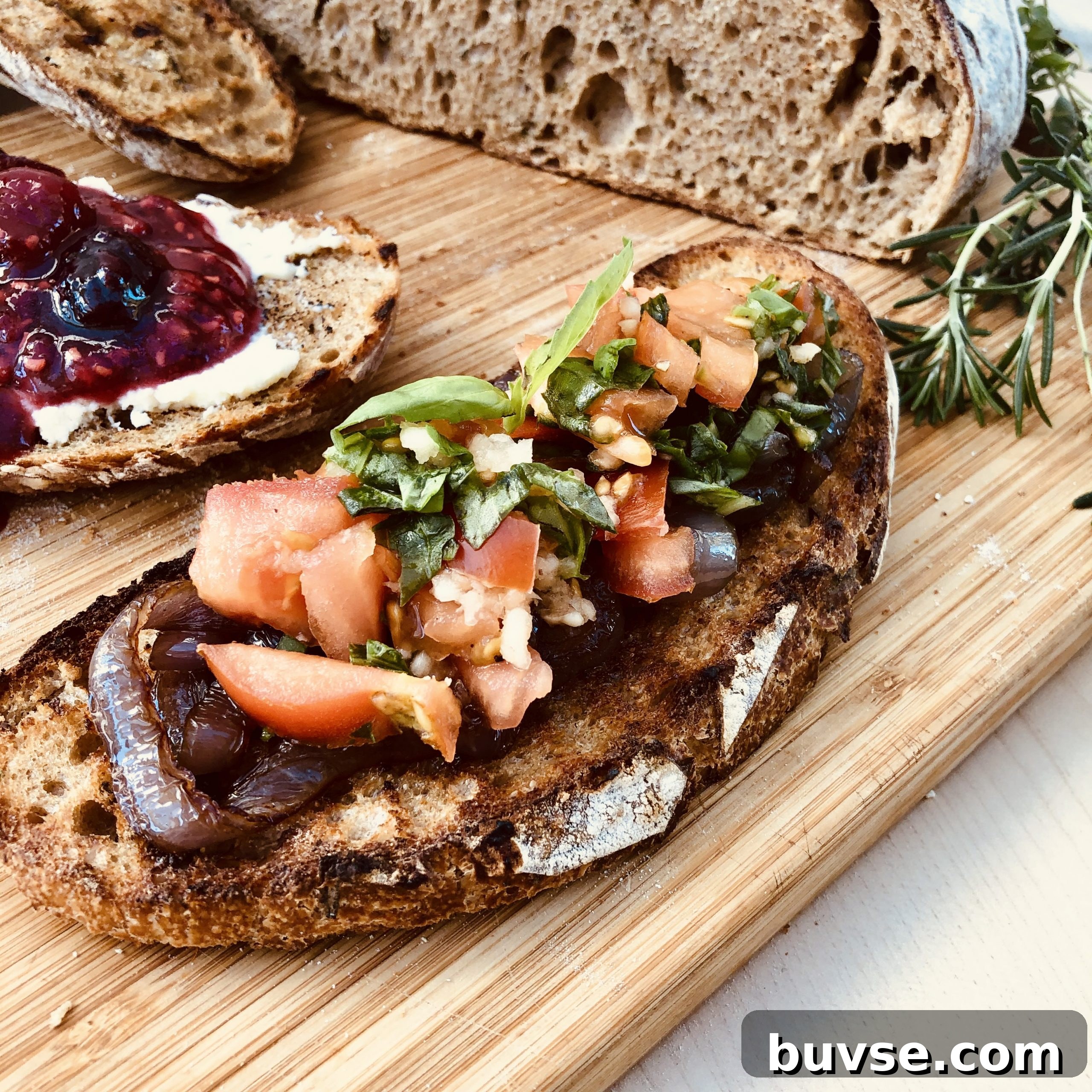 Savory bruschetta on roasted garlic and herbs sourdough.