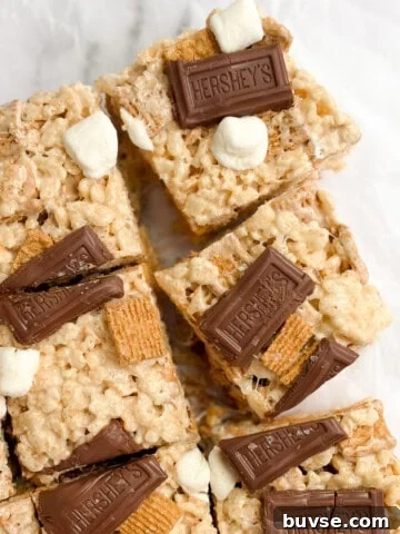 a few s'mores golden graham rice krispie treats cut into squares.
