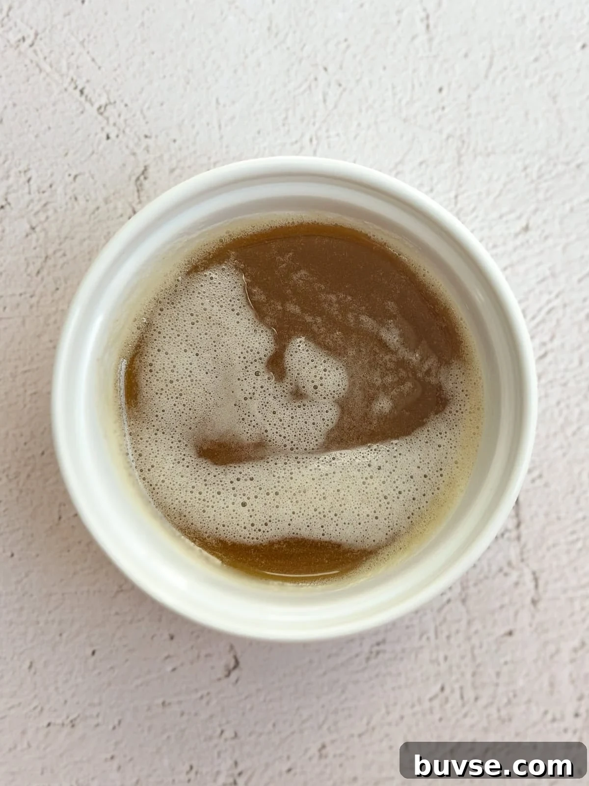 browned butter in a cup