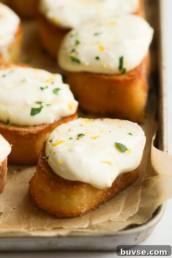 Whipped Ricotta Crostini with Honey and Lemon Zest 6 closeup shot of ricotta toast