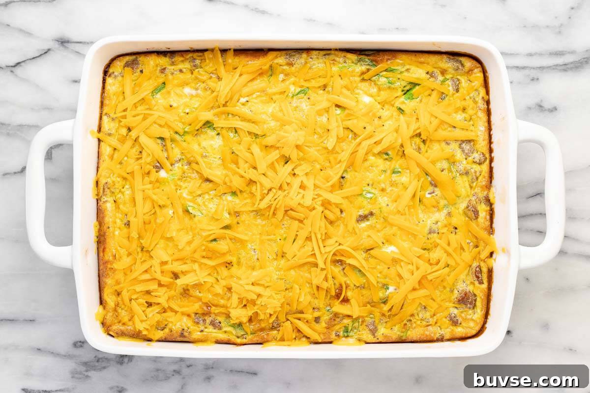Cheesy Sausage Breakfast Casserole with Hash Browns 10 Breakfast casserole topped with shredded cheese.