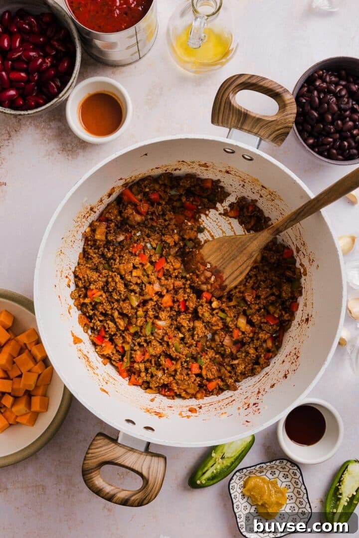 Hearty Sweet Potato Turkey Chili Recipe 4 Ground beef and veggies cooked in a large pot.