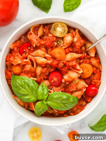 A white bowl filled with vegan bolognese.