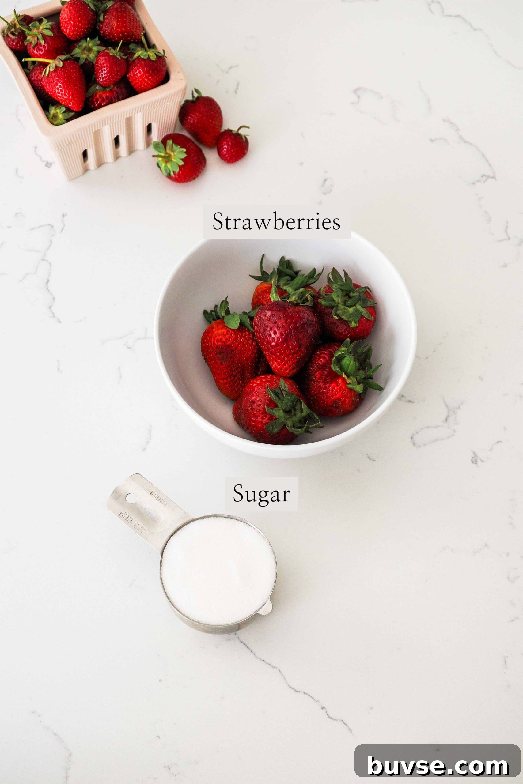 Ingredients needed to make strawberry simple syrup.