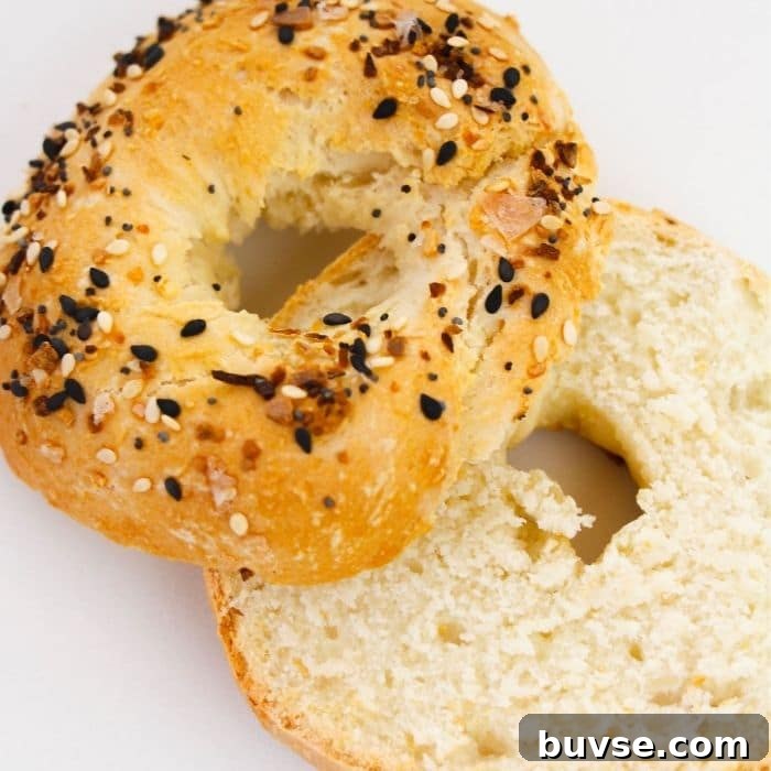 sliced bagel on counter with everything bagel seasoning on top 