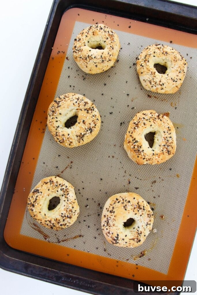 cooked bagels on cookie sheet