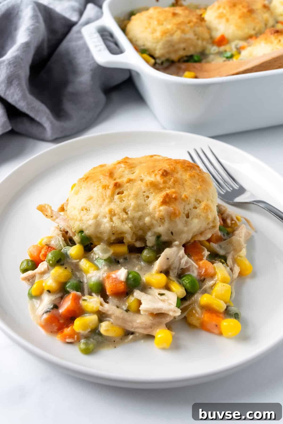 Chicken Pot Pie with Greek Yogurt Biscuits on a white plate.