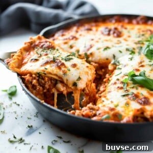 Easy skillet lasagna with ground beef in a cast iron pan.