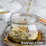 Close up view of a glass container with Dukkah