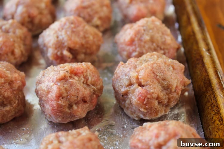 homemade meatballs ready to be baked in the oven.