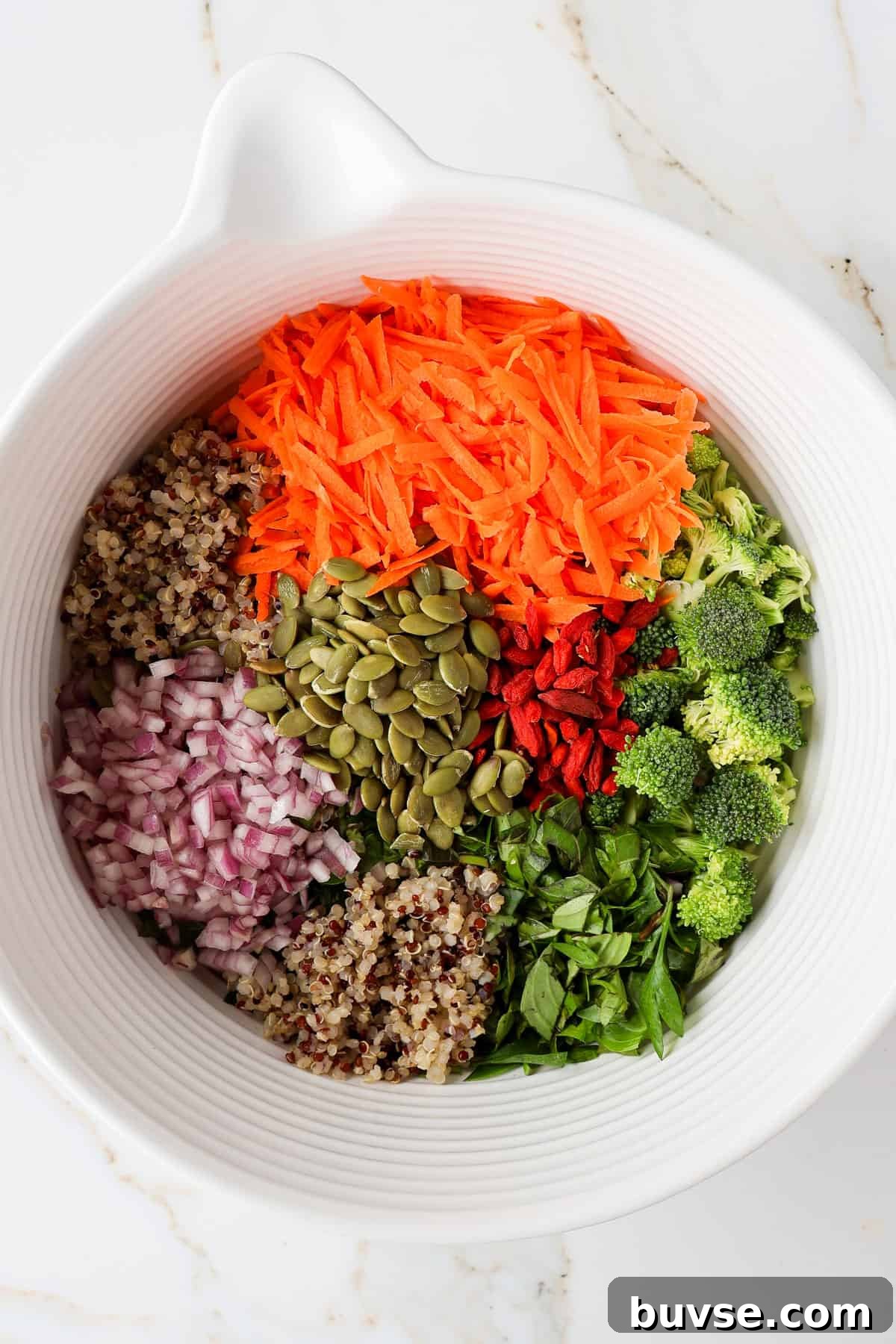 Salad ingredients in a mixing bowl.