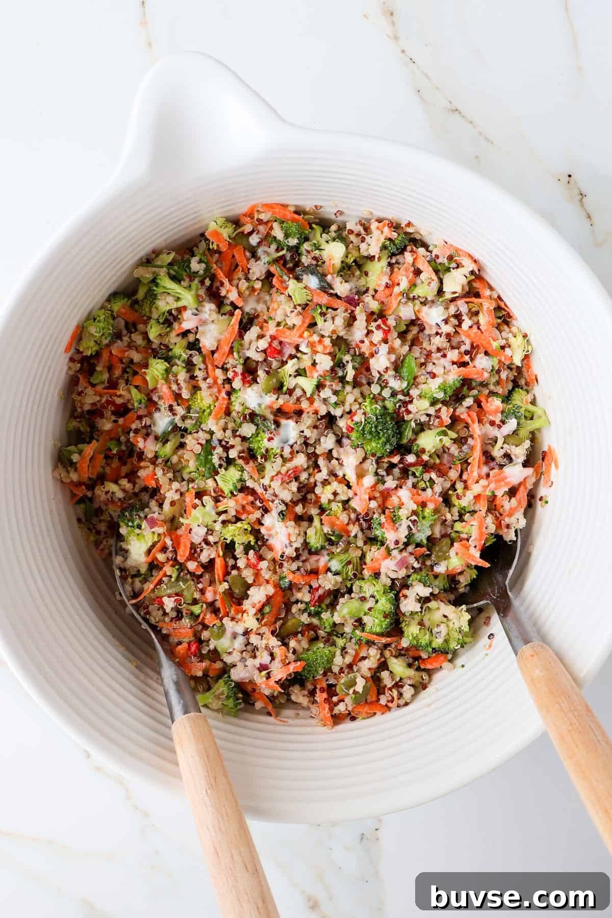 Broccoli quinoa salad in a mixing bowl.