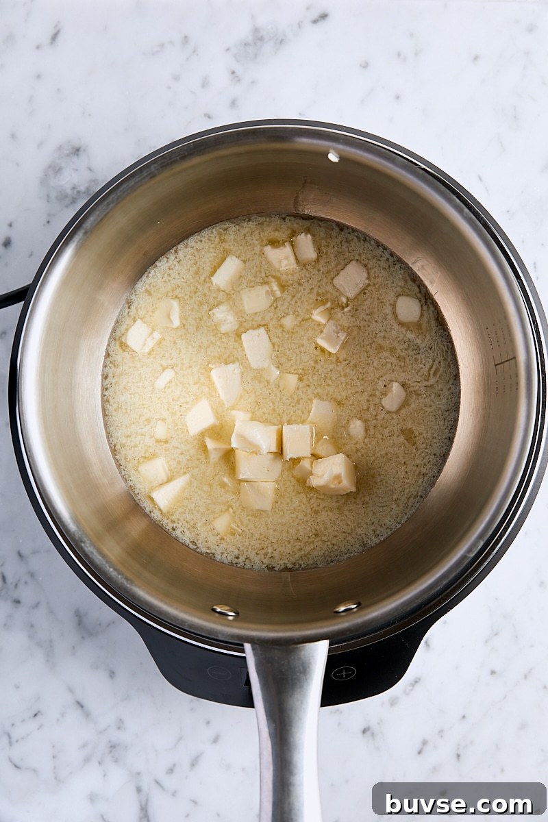 Homemade 5-Minute Butterscotch Sauce 5 Cubed butter melting in saucepan