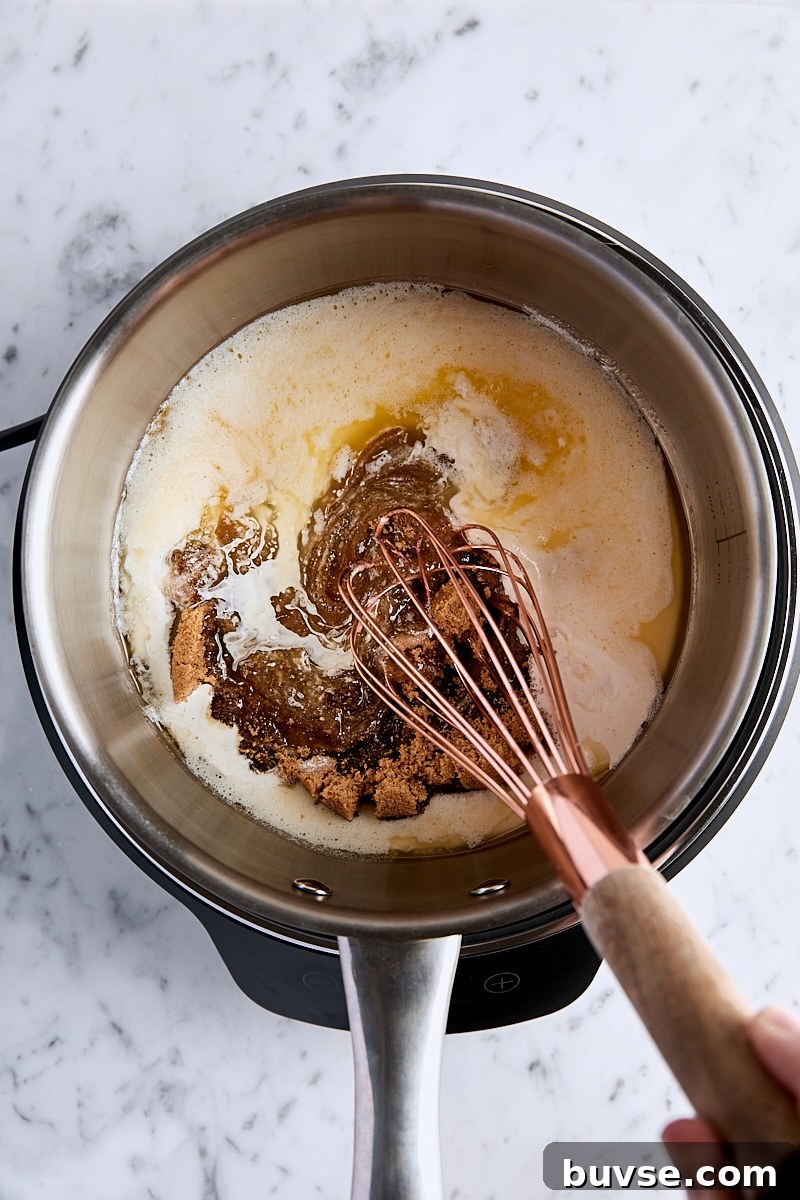 Homemade 5-Minute Butterscotch Sauce 7 Whisking together melted butter, dark brown sugar, heavy cream, and lemon in saucepan