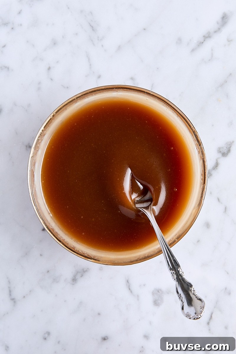 Homemade 5-Minute Butterscotch Sauce 9 Homemade butterscotch sauce in glass bowl with spoon