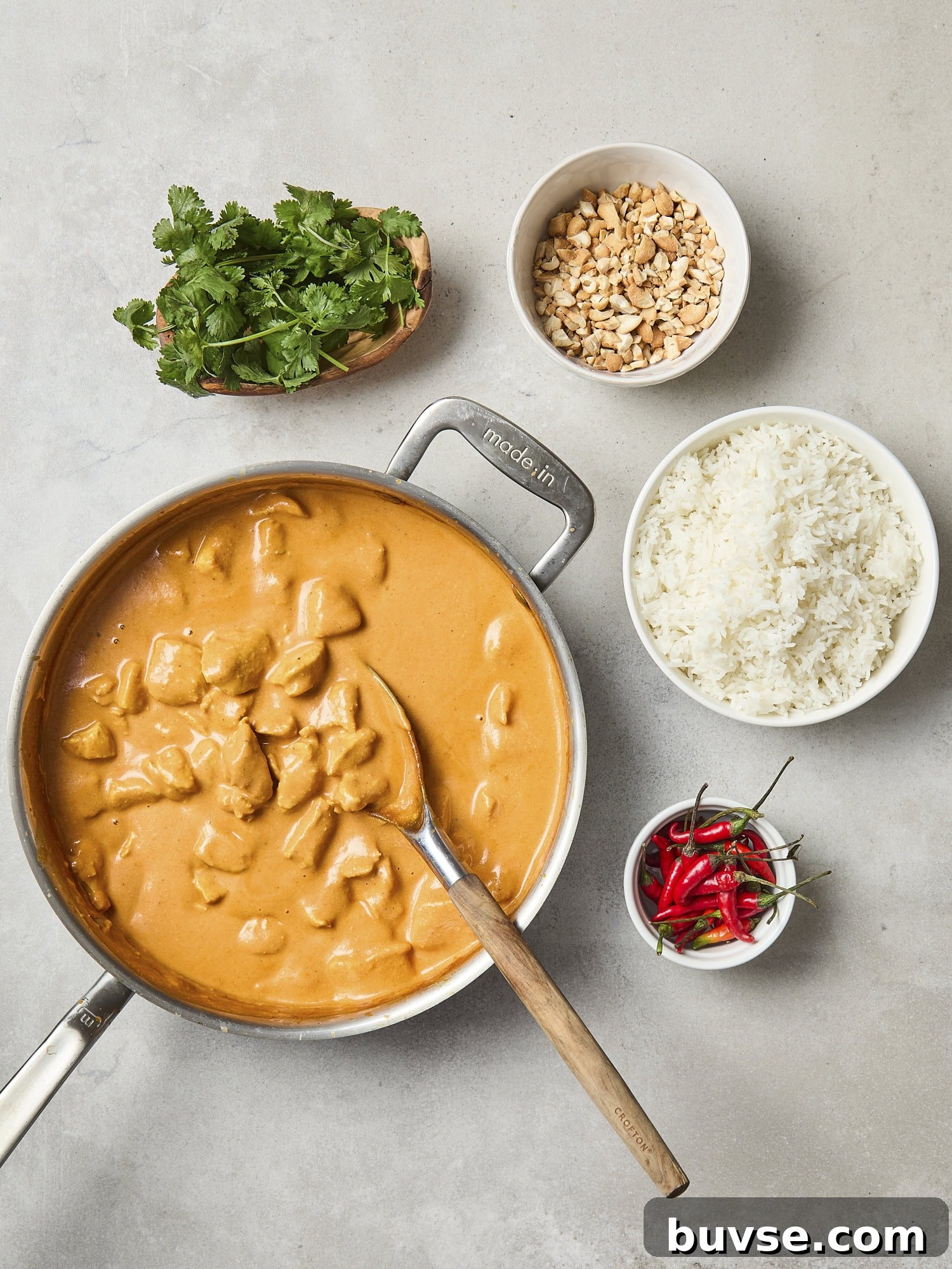 All components and toppings for butter chicken recipe.