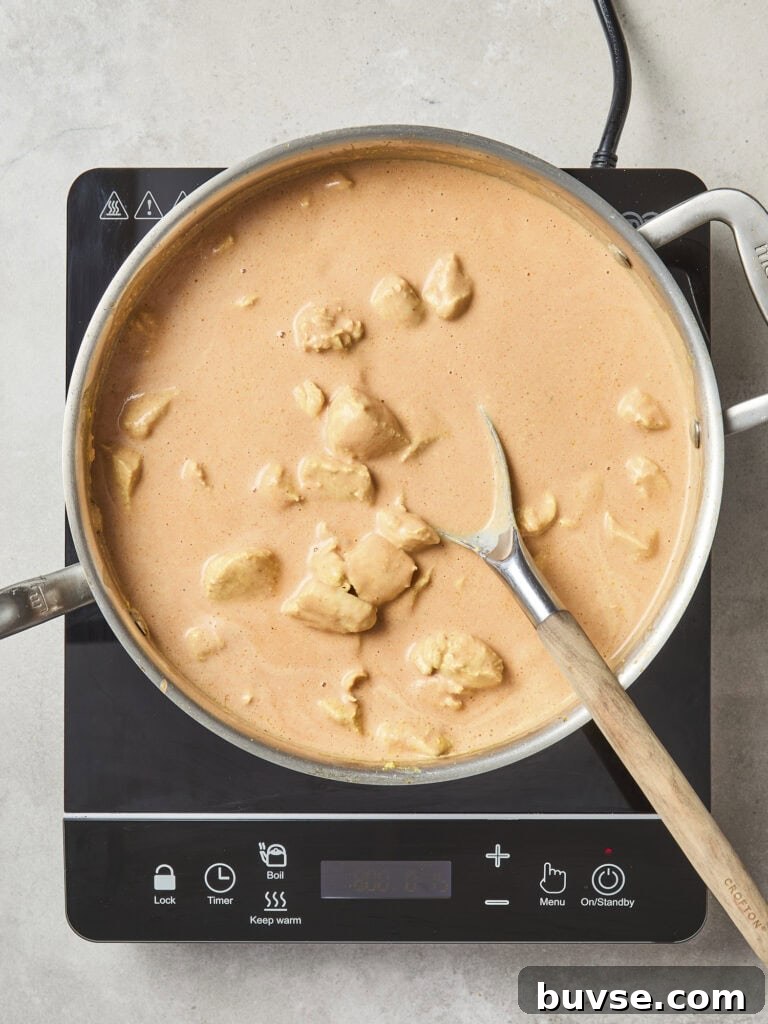 Chicken in saucepan before simmering.