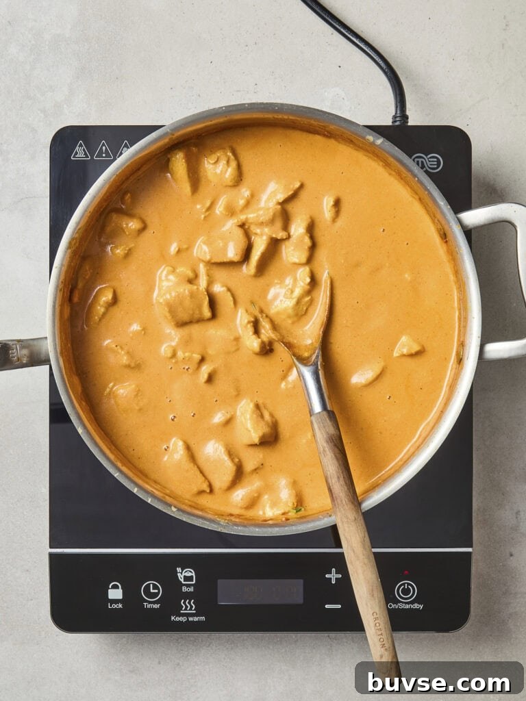 Butter chicken in saucepan after simmering.