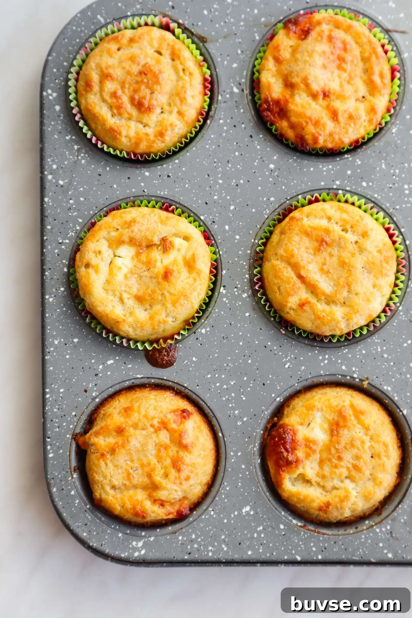 Flourless savoury oatmeal feta muffins! This easy savoury breakfast muffin recipe is simple, gluten free and so delicious! If you're looking for some new easy meal prep breakfast ideas, you've got to try these feta muffins!