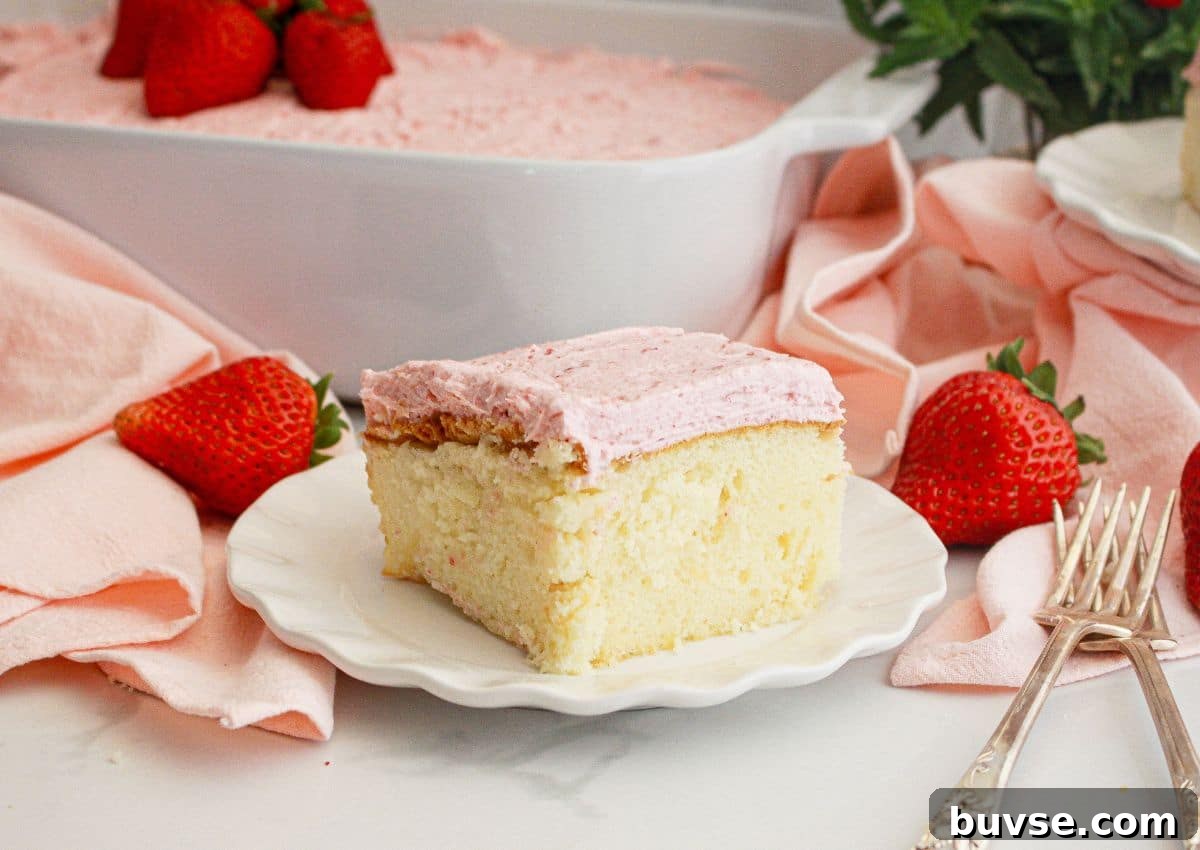 Vanilla Sheet Cake Recipe with Strawberry Frosting 11 Slice of cake on a small plate.